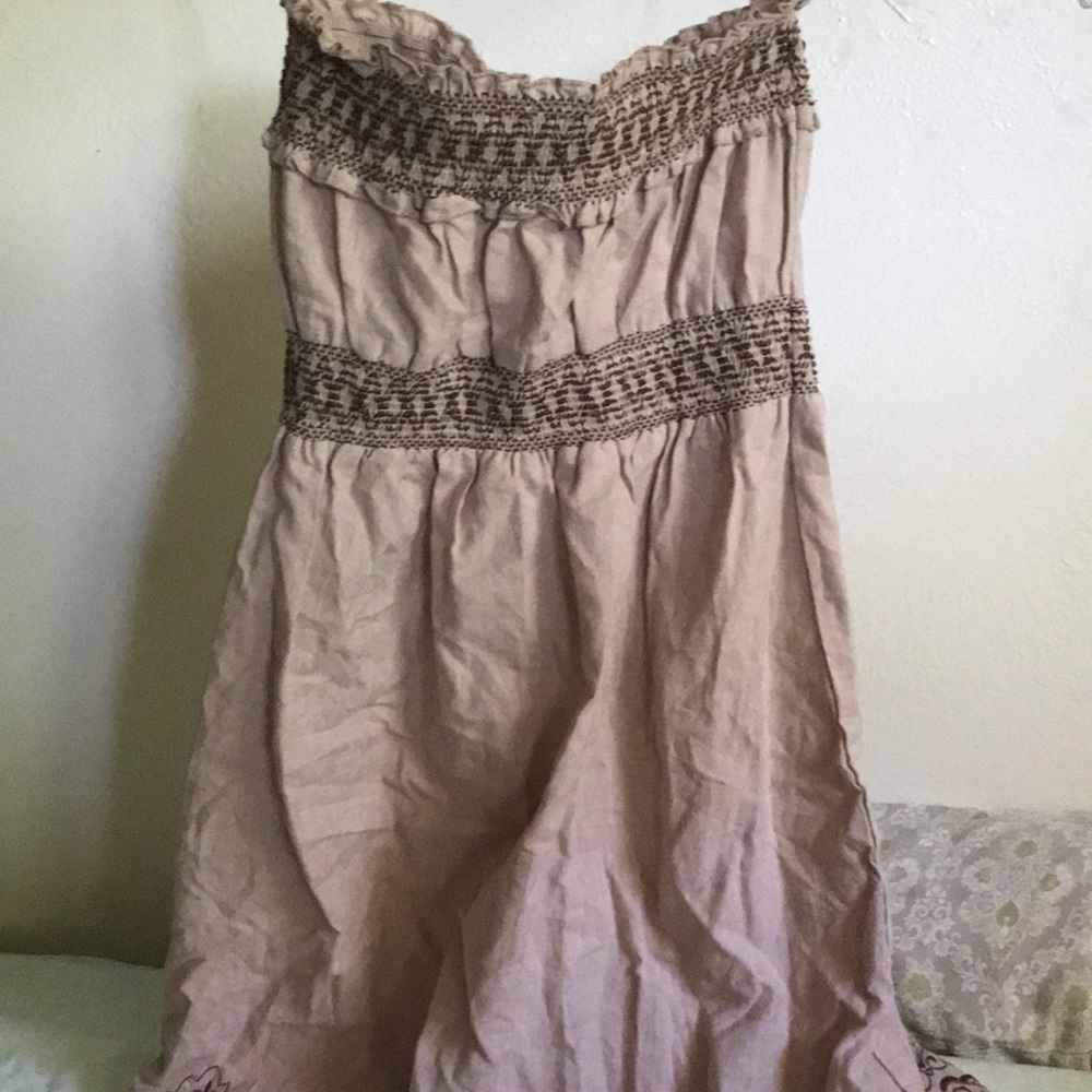 A cute vintage tan strapless dress